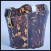 An unusual faux tortoiseshell tea caddy in the for