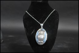 A sterling silver rolo link necklace chain having