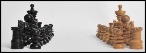 An early 20th century ebony and boxwood chess set