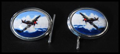 A pair of sterling silver cufflinks having enamel