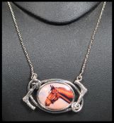 A sterling silver and enamel pictorial necklace of