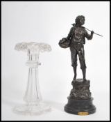 A 19th century cut glass table Lustre centre piece together with a spelter figure raised on a