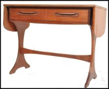 A 1970's retro G-Plan teak wood drop side writing