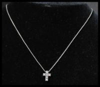 A hallmarked 18ct white gold and diamond pendant n
