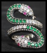 A sterling silver silver CZ and emerald adorned ri