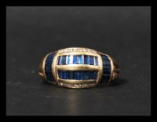 A 14ct gold blue sapphire and diamond ring having