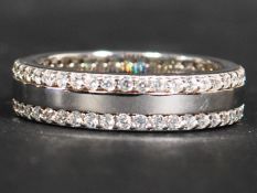 A sterling silver and CZ full eternity ring having