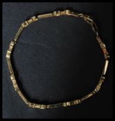 A 18ct gold fancy link bracelet set with white sto