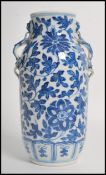 A 19th century blue and white ceramic vase having
