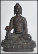 A 19th century Oriental Chinese bronze figurine of