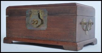 A Chinese mahogany jewellery casket having a carve