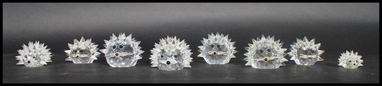 A group of eight Swarovski crystal hedgehogs of ba
