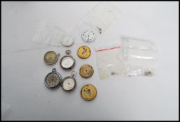 A collection of vintage pocket watches and parts t