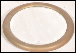 An early 20th century brass framed circular fish e