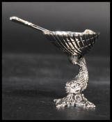 A sterling silver miniature tazza and spoon. The t