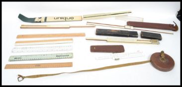 A group of vintage 20th century slide rules and me