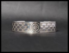 A hallmarked 925 silver designer Gucci cuff bangle