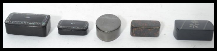 A group of snuff boxes dating from the 19th century to include a Masonic pewter box of oval form