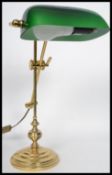 A vintage 20th century bankers desk lamp raised on an adjustable knopped column with stepped