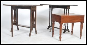 An early 20th century mahogany Sutherland drop leaf table together with another along with a 19th