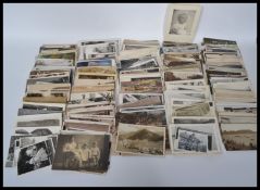 A collection of postcards and photographs dating from the early 20th century to include local