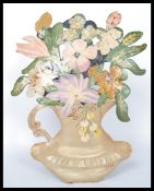 A 19th century Victorian toleware painting of a vase of flowers signed by artist in red Michelet.
