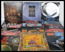 A collection of long play LP vinyl rock records featuring various artists to include Def Leppard,