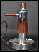A 1960's retro Italian chrome coffee electric espresso machine of column form with brown plastic
