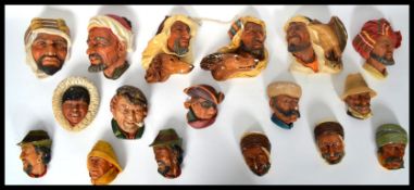 A collection of vintage Bossons heads constructed of plaster being marked to the verso for each.