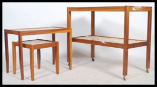 A retro 1970's Danish inspired teak and tile top butlers serving trolley. Raised on castors with