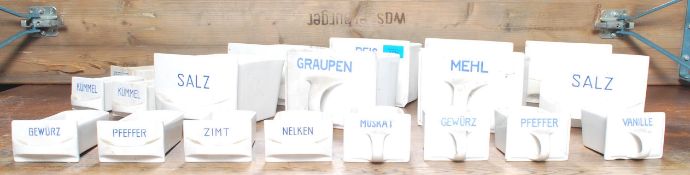 A large collection of early to mid 20th century continental porcelain spice drawers. All white