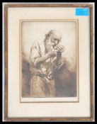 A framed and glazed limited edition etching 50 / 75 titled ' A Pipe Of Bully ' of an old man