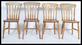 A good set of 4 19th century Victorian beech and elm windsor dining chairs raised on turned legs