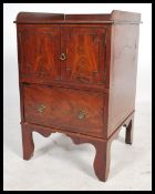 An 18th / 19th century Georgian George III gallery backed flame mahogany pot cupboard with twin door