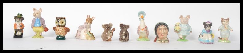 A collection of Beatrix Potter ceramic figurines by Royal Albert and Beswick. All stamped to base.
