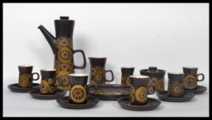 A vintage 20th century pottery coffee service consisting of a tall coffee pot with milk creamer