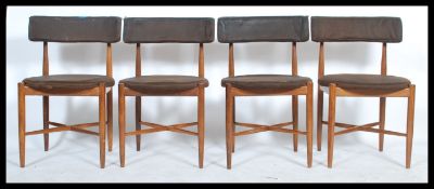A set of 4 retro 1970's G-Plan teak wood dining chairs in the manner of Kofod Larsen. Raised on