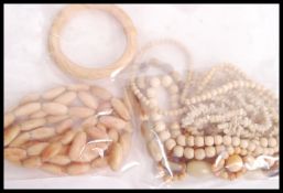 A group of 19th century bone jewellery to include bangles and bead necklaces along with a white
