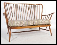 A mid century  Ercol ' Windsor ' pattern three seat sofa settee,  with tapestry William Morris