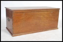 An early 20th century mahogany blanket box of rectangular form with hinged top having brass plaque
