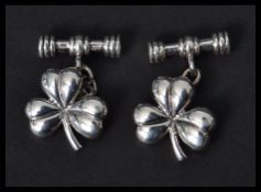 A pair of sterling silver lucky clover gentlemen's cuff links. Weighs 10.1 grams.