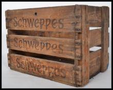 A retro mid century Industrial wooden crate with original notation to the sides for Schweppes.