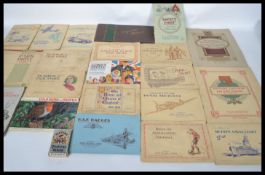 A collection of vintage 20th century cigarette cards. Mostly held within albums and some loose.