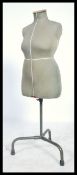 A vintage retro mid 20th century Dress makers haberdashery dummy by Singer raised on an adjustable