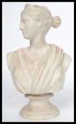 A 19th century Bisque figurine bust statue of Diane the Huntress raised on an ebonised plinth