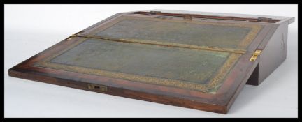 A 19th century Victorian rosewood and mother of pearl writing slope having a fully appointed