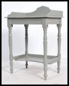 A 20th century antique style painted shabby chic console table. Raised on turned supports with