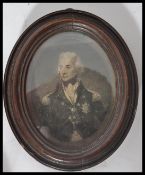 An early 19th century mahogany framed oval portrait miniature print of Admiral Nelson in naval