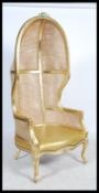 A contemporary gilt wood and bergere Louis 16th revival butlers hooded hall chair. Raised on