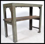 A stunning vintage 20th century industrial metal factory worktop / bench / side table raised on a